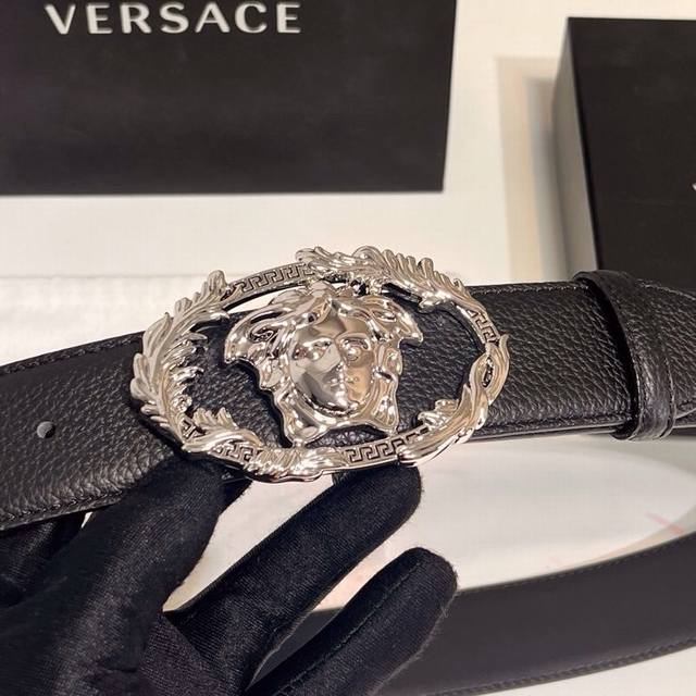 Versace's new calfskin leather belt, adorned with buckle Crest accessories. The