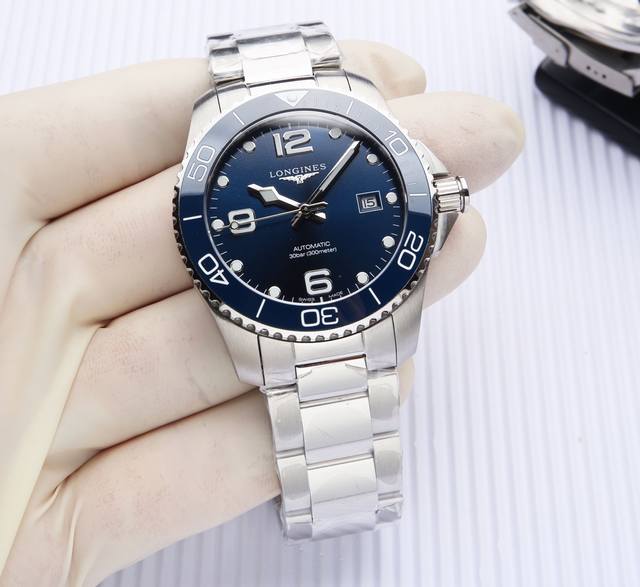 Longines Conquest Sport series, gold double-domed design with sapphire crystal,