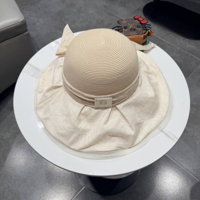 罗意威夏季国风草编蝴蝶结遮阳帽子女大檐防晒帽优雅度假防紫外线沙滩帽