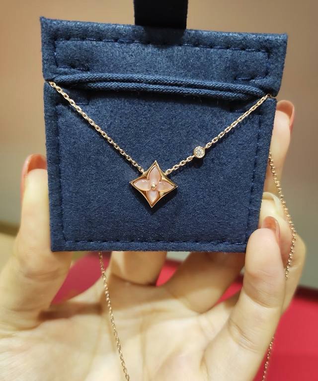 Louis Vuitton monogram mother-of-pearl necklace in gold.