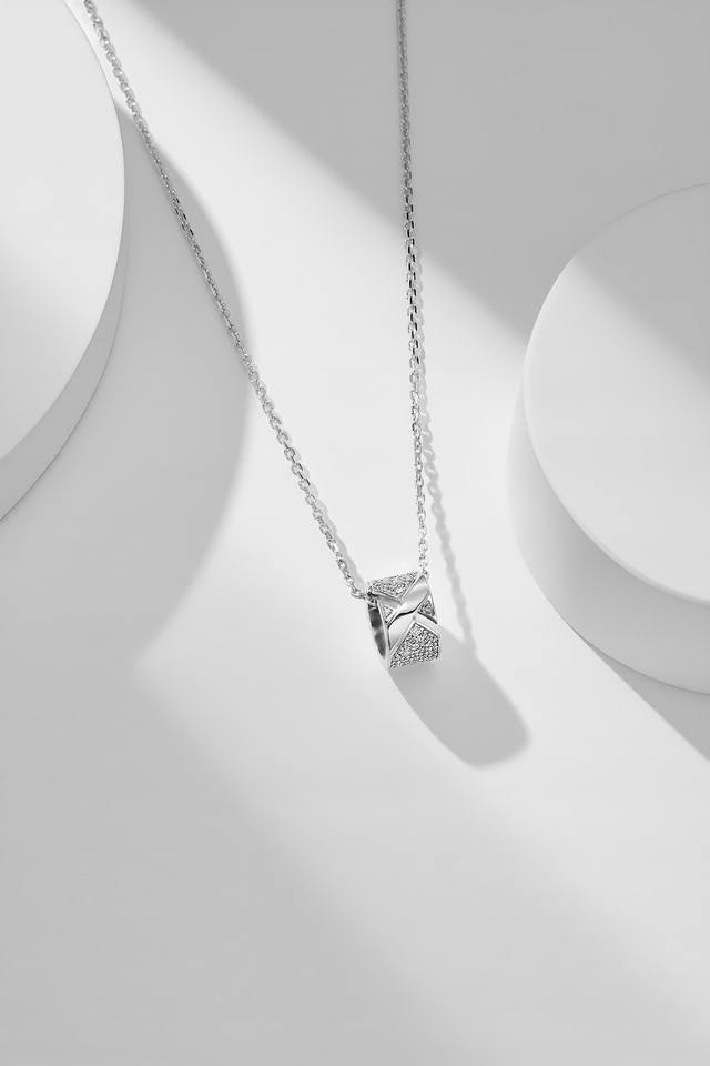Liens Evidence necklace, a new 2023 design featuring a small cylindrical pendant Liens Evidence necklace, a new 2023 design featuring a small cylindrical pendant