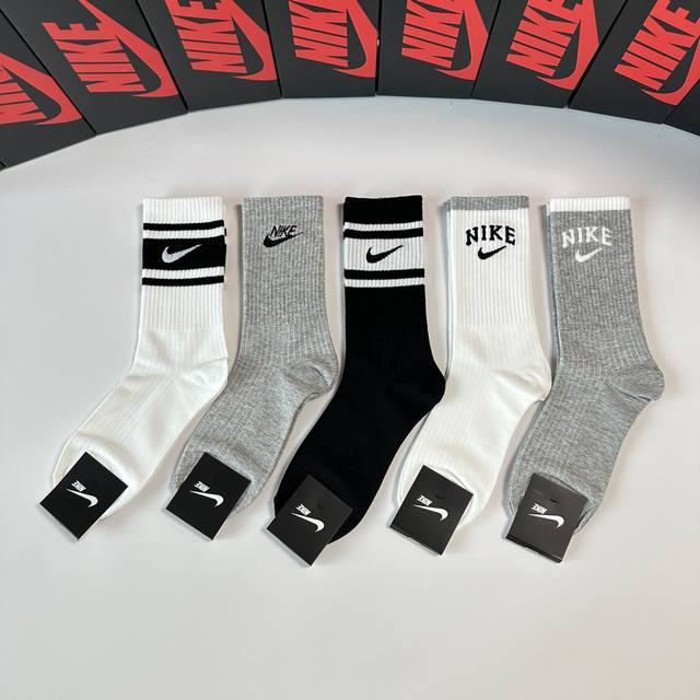 Nike's new mid-length slouch socks (with packaging) - 5 pairs per box. Same styl