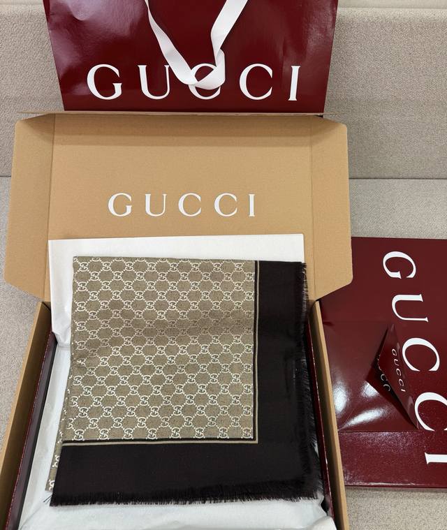 A special new coffee-colored Gucci scarf featuring the iconic Gg pattern paired