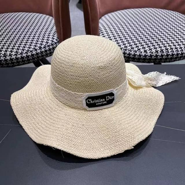 Dior summer sun hat with wide brim, perfect for outings and vacations, with a bo