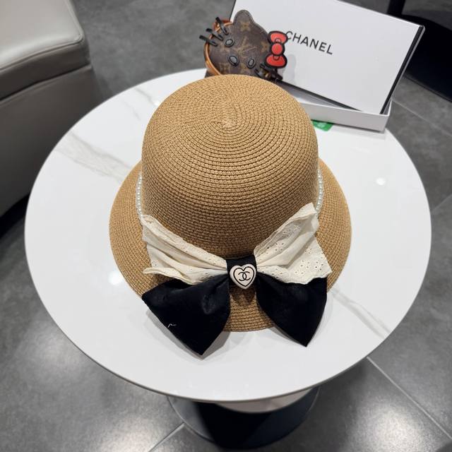 Chanel straw hat, a travel essential, head circumference 57cm. Chanel straw hat, a travel essential, head circumference 57cm.