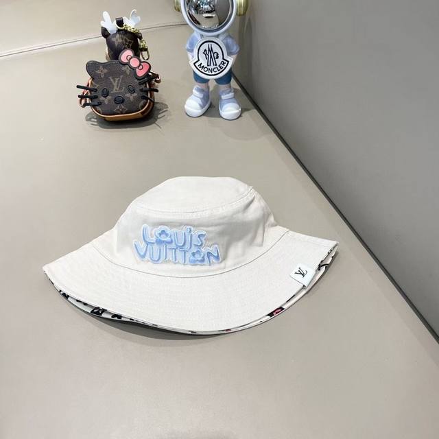 Lv Tyer collaboration reversible bucket hat, colorful logo with small flowers in