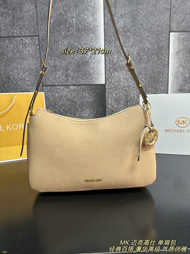 Comes with Box The Michael Kors Nolita shoulder bag is made of soft Nubuck leath Comes with Box The Michael Kors Nolita shoulder bag is made of soft Nubuck leath
