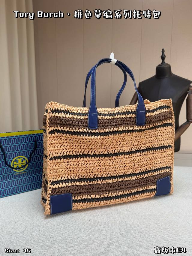 Comes with a box. This Tory Burch color-blocked straw tote bag is made of natura Comes with a box. This Tory Burch color-blocked straw tote bag is made of natura