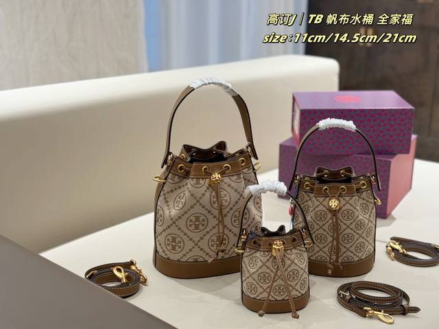 140 150 Tory Burch Tmonogram Canvas Bucket Bag Featuring the new Tmonogram patte 140 150 Tory Burch Tmonogram Canvas Bucket Bag Featuring the new Tmonogram patte