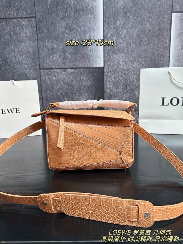 Comes with box. Loewe geometric bag. This Loewe Puzzle series mini geometric bag