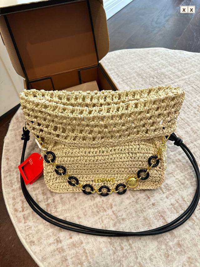 Gift Box Packaging. Loewe's "Ola" straw bag, named for its Spanish waves, featur