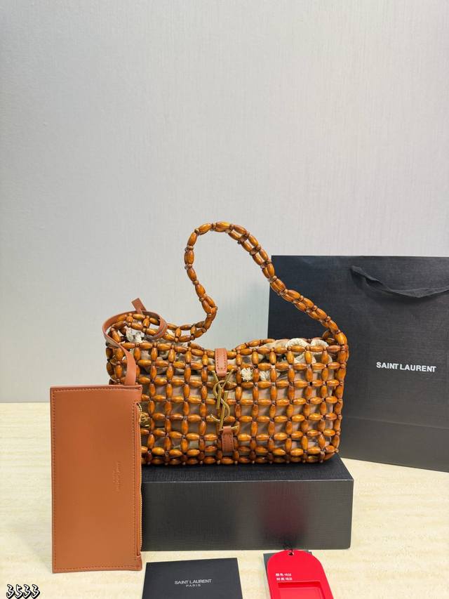 YSL Icare Woven Handbag. This YSL Icare woven handbag boasts a unique and sophis