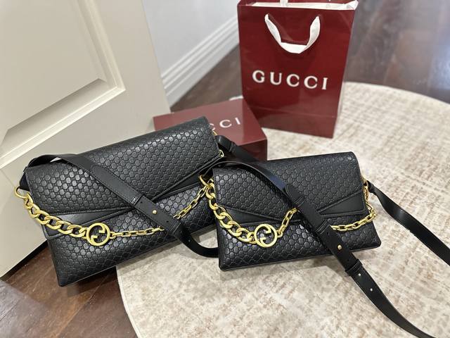 Gift box packaging. Gucci Gg Chain suede handbag with embossed Gg logo, exquisit