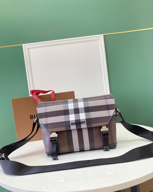 Model: 85050 A Burberry structured messenger bag featuring the brand's signature