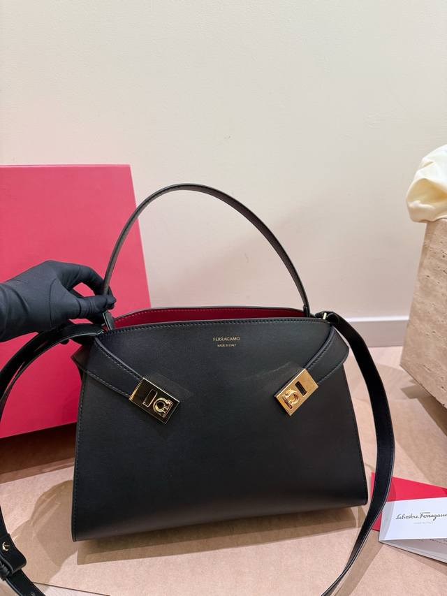 Comes with box. Ferragamo Hug Bag. A classic shoulder bag that combines style an
