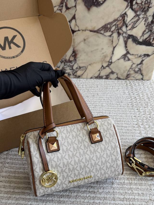 210 Comes with box. Michael Kors Classic Monogram Boston Mini Bucket Bag. The ti