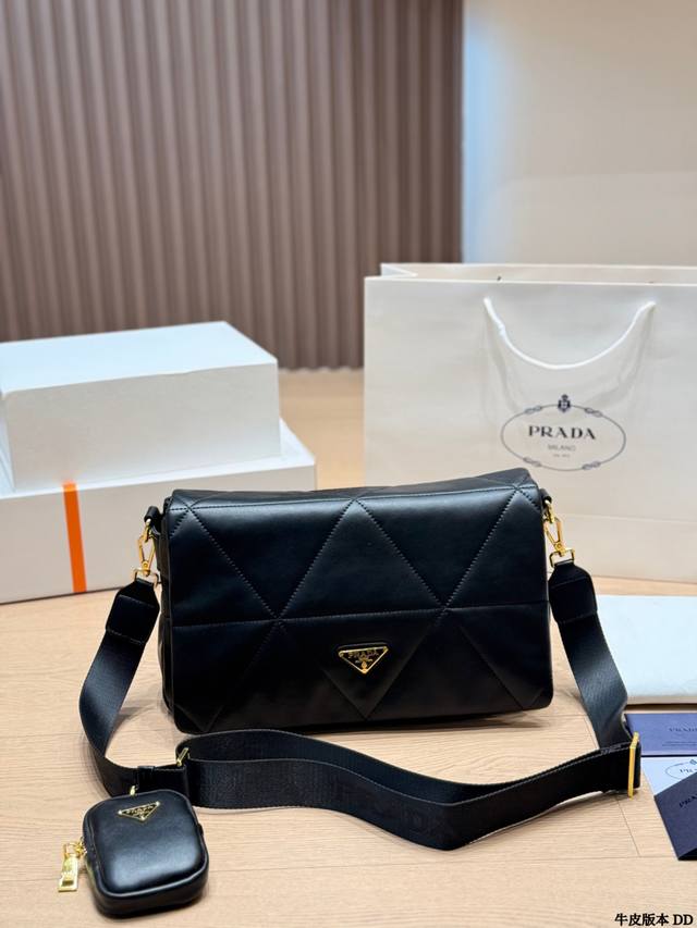 Prada quilted leather crossbody bag. This black quilted leather crossbody bag f Prada quilted leather crossbody bag. This black quilted leather crossbody bag f