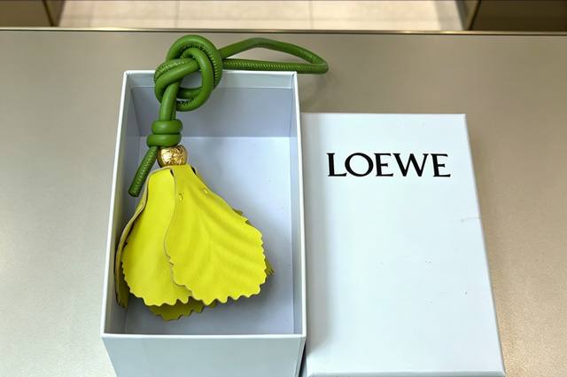 - Loewe Tulip Charm. A classic calfskin tulip charm with a gold finish and an An