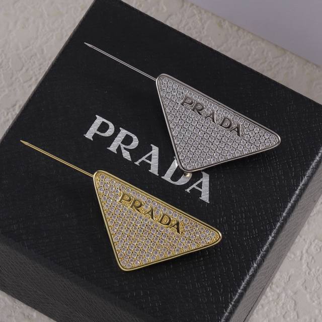 Prada brooch