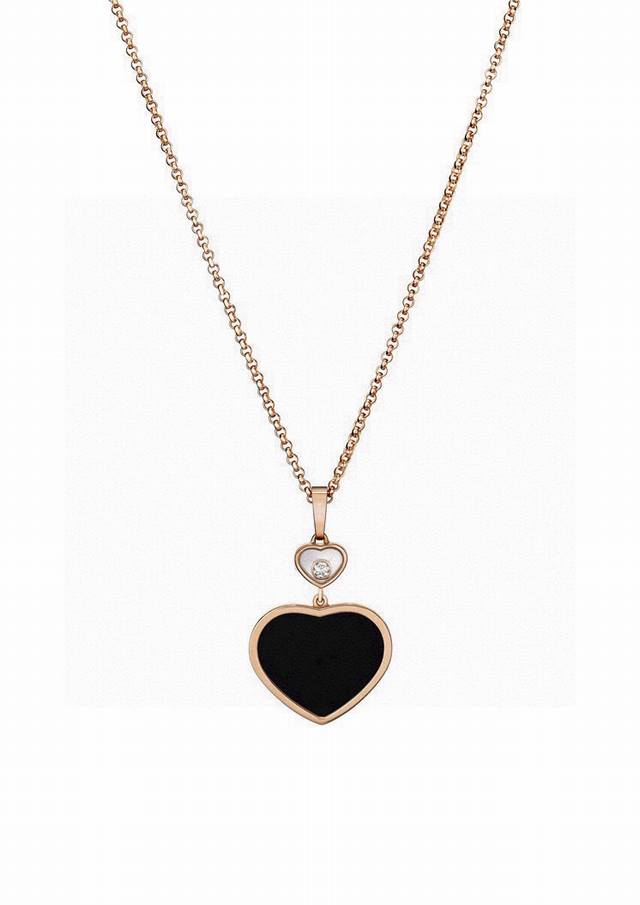 Chopard necklace with black agate, heart-shaped pendant, and sparkling diamonds.