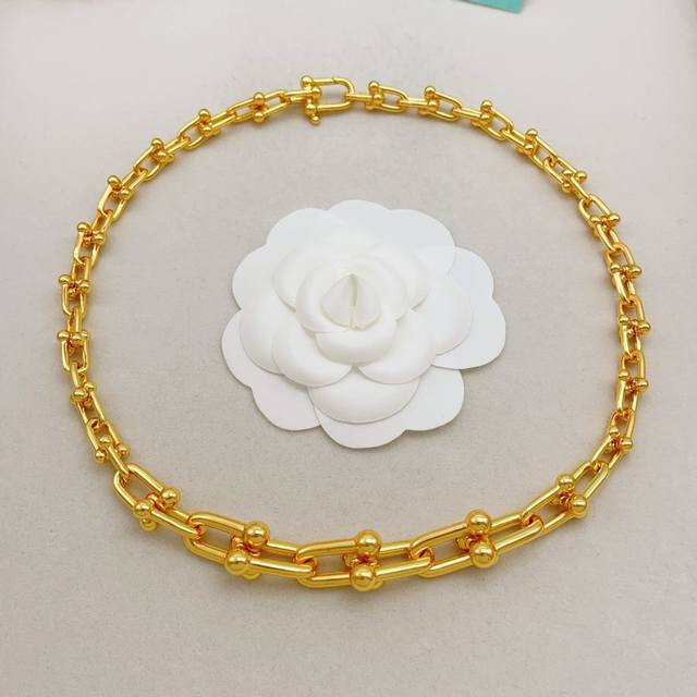 Tiffany's latest gold gradient necklace, made of the same Z batch of brass, is v