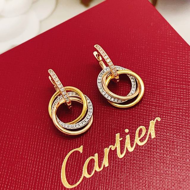 Cartie* Cartie's latest tricolor diamond-encrusted round earrings are made of th Cartie* Cartie's latest tricolor diamond-encrusted round earrings are made of th