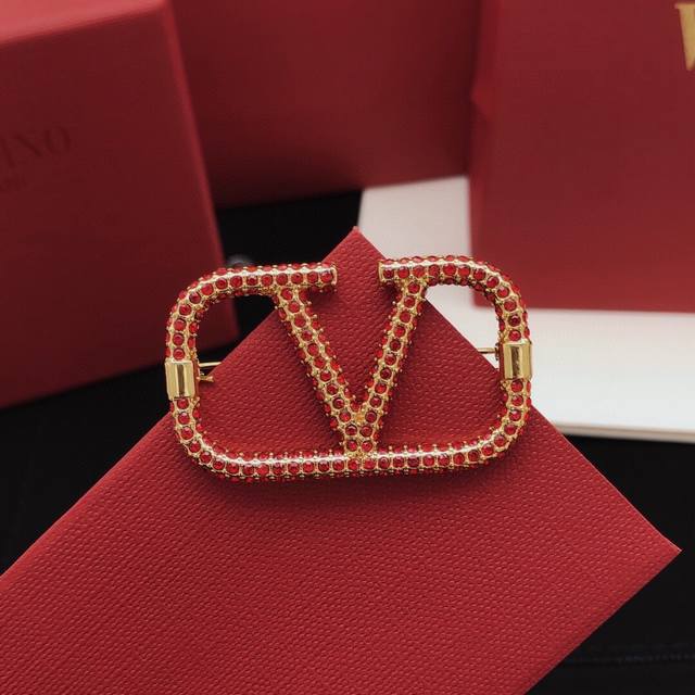 Valentino brooch, V-shaped, fully diamond-encrusted.