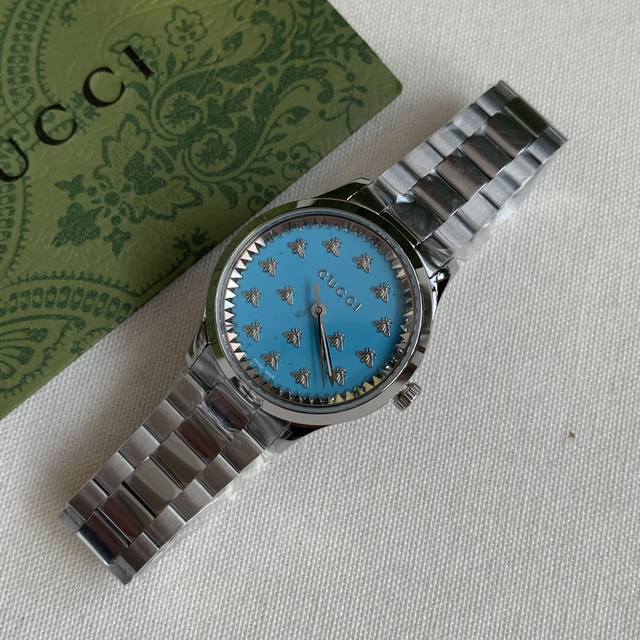 Gucci, blue. This is extremely rare; you generally don't see this color scheme a