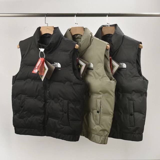 Price: 190 9960 The North Face Down Vest Embossed, three labels match, 100% Poly