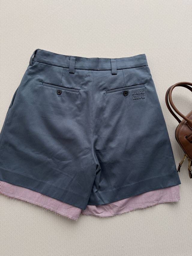 P420 Miumi* These twill Bermuda shorts, featuring poplin details and a unique ra