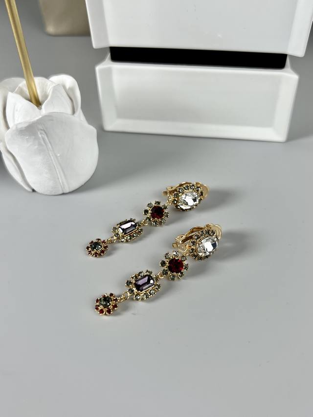 P100. Dolce & Gabbana colored diamond earrings, the only original quality produc