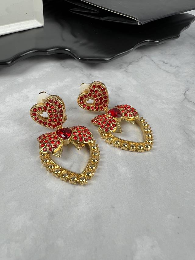 P100. Dg Dolce & Gabbana bow heart earrings
