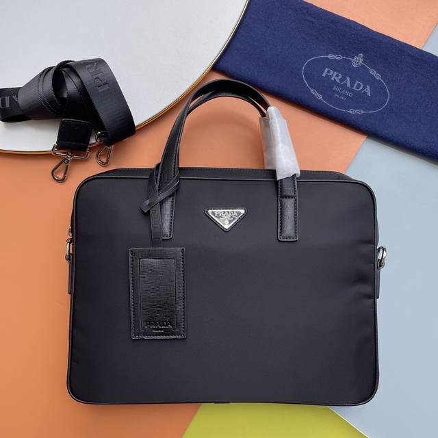 p700, Prada men's briefcase, crafted from durable Oxford cloth, is sturdy, wrink