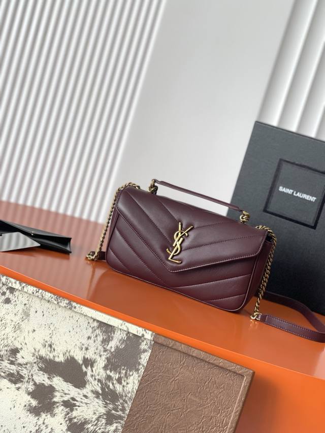 p730 This new Loulou lambskin bag, in a deep red and gold finish, features a sof