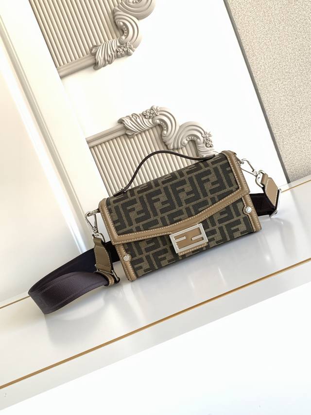620 Baguette Soft Trunk handbag is crafted from fabric with an Ff Eclissi jacqua