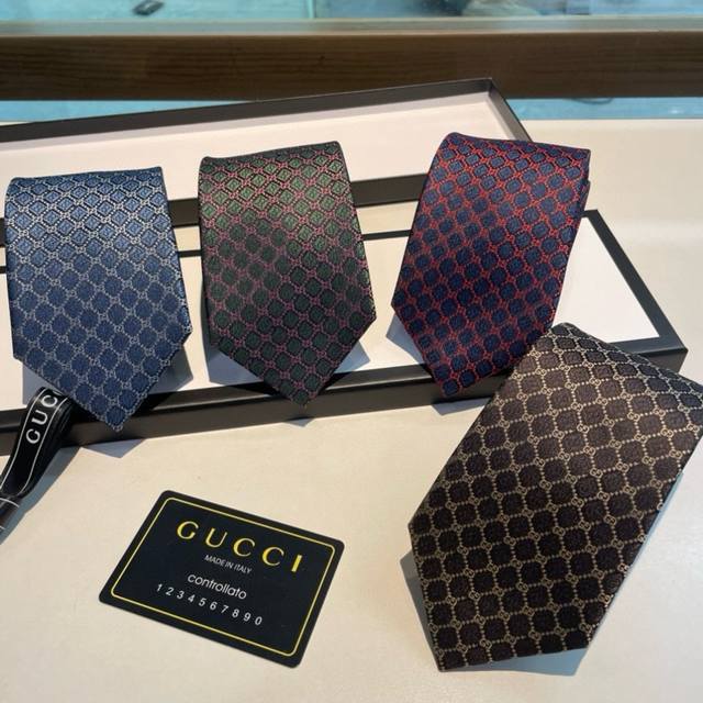 80 This silk tie features a decorative pattern interwoven with geometric diamond
