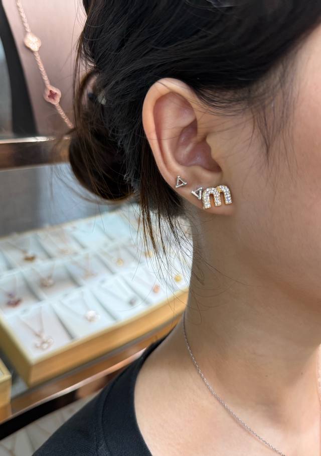 p70 Miu Miu M Logo Earrings These Miu Miu M logo earrings feature gold metal acc