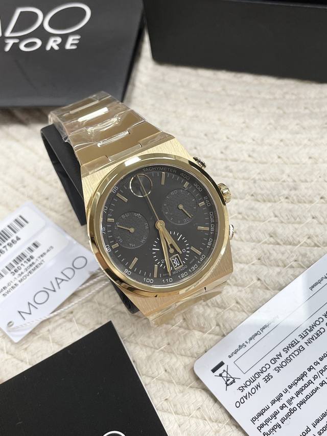 p1040 Movado Bold series six-hand chronograph, featuring a full gold and black g
