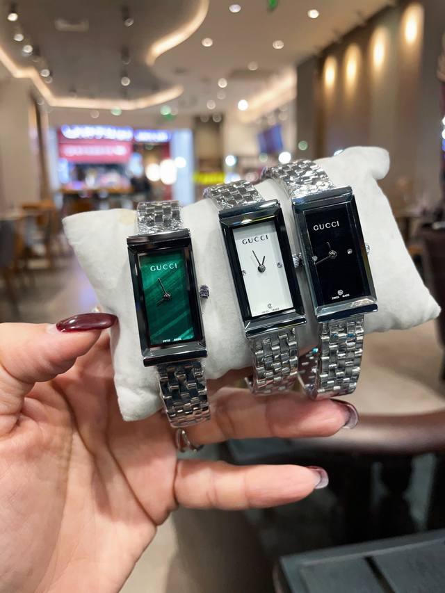 310 Gucci women's watch from the G-Frame series features an elegant rectangular