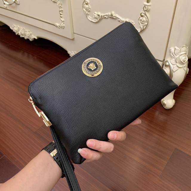 p330 New Versace clutch bag with box included. The leather is soft and comfortab