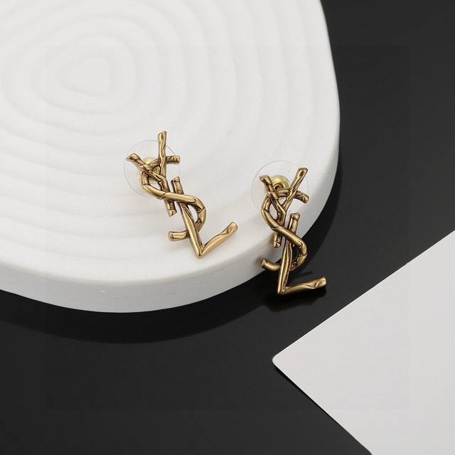 60 YSL Saint Laurent Earrings, original brass material. Yves Saint Laurent, foun