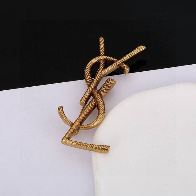 70 Saint Laurent (YSL) brooch: Classic, luxurious, fashionable, and versatile, l