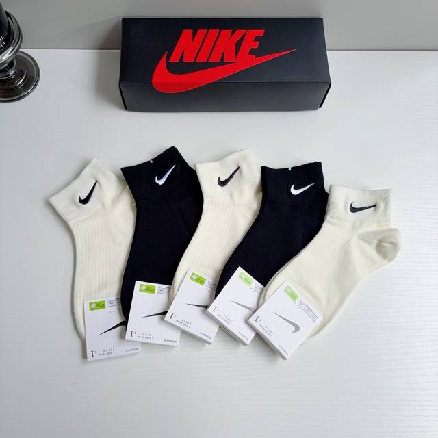 Includes packaging p60. One box contains 5 pairs of new Nike embroidered short c