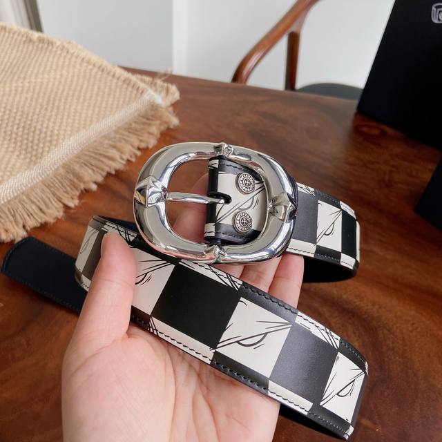 290 -- Chrome Hearts Belt. Features a fishbone D-ring buckle, brass hardware pla