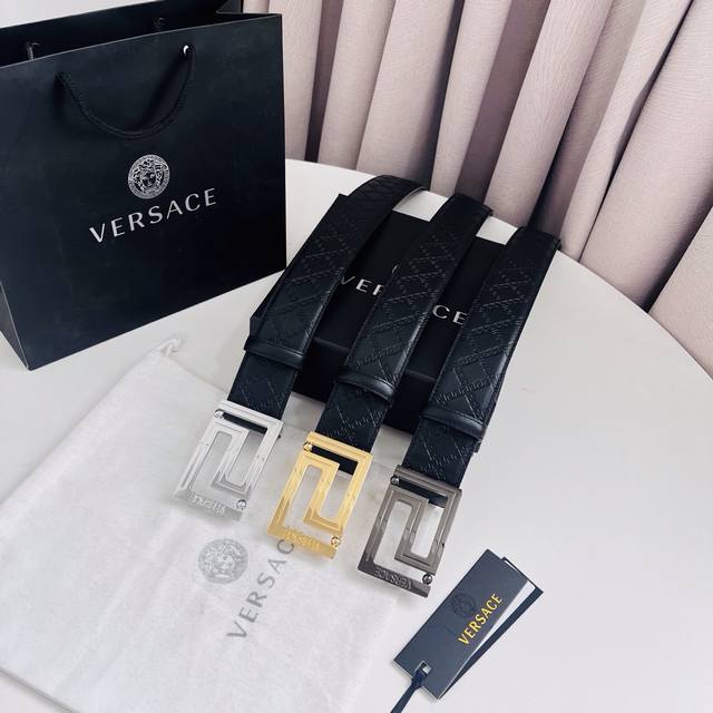 180 Versace: This Greek key pattern embossed belt features a striking Medusa hea 180 Versace: This Greek key pattern embossed belt features a striking Medusa hea