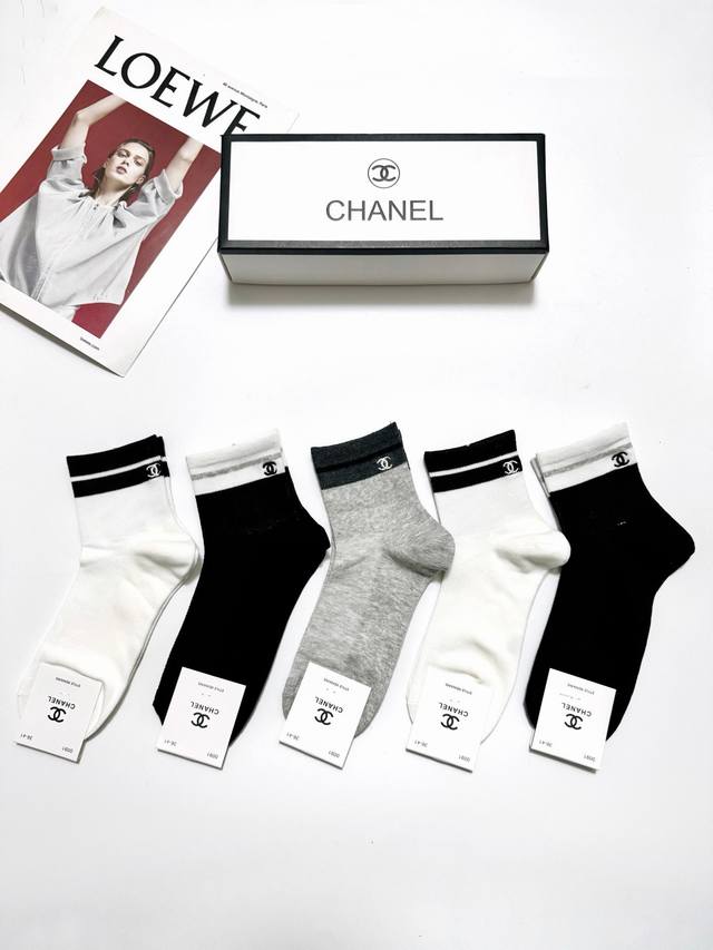 50 A box of 5 pairs of Chanel classic embroidered logo socks, made of pure cotto