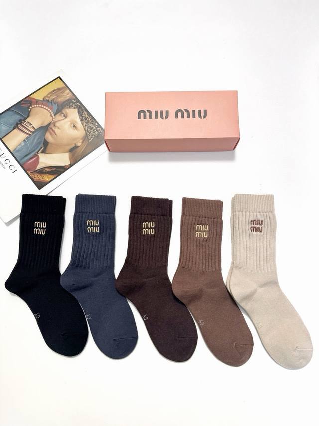 70 A box of 5 Miu Miu classic embroidered logo cashmere blend mid-calf socks, so
