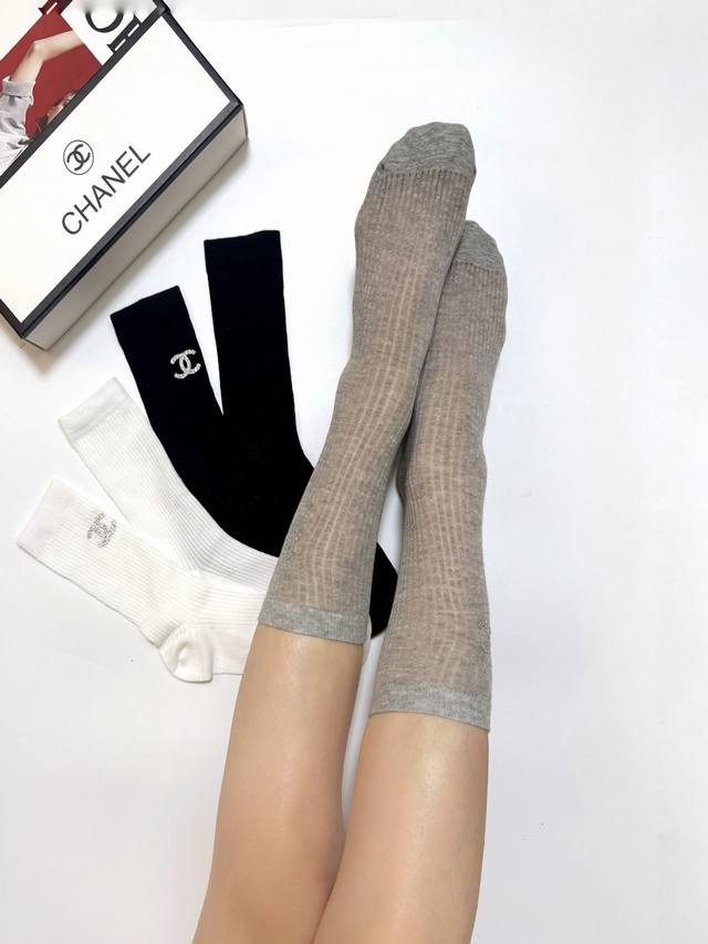 60 A box of 3 pairs of Chanel classic striped double C logo socks, pure cotton,