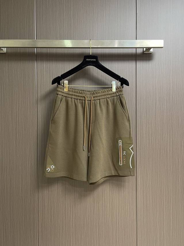 230 Loewe Printed Athletic Shorts, made from technical plain knit fabric, featur