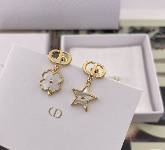 p70 Dior Star and Four-Leaf Clover Earrings: Featuring a gold CD logo paired wit